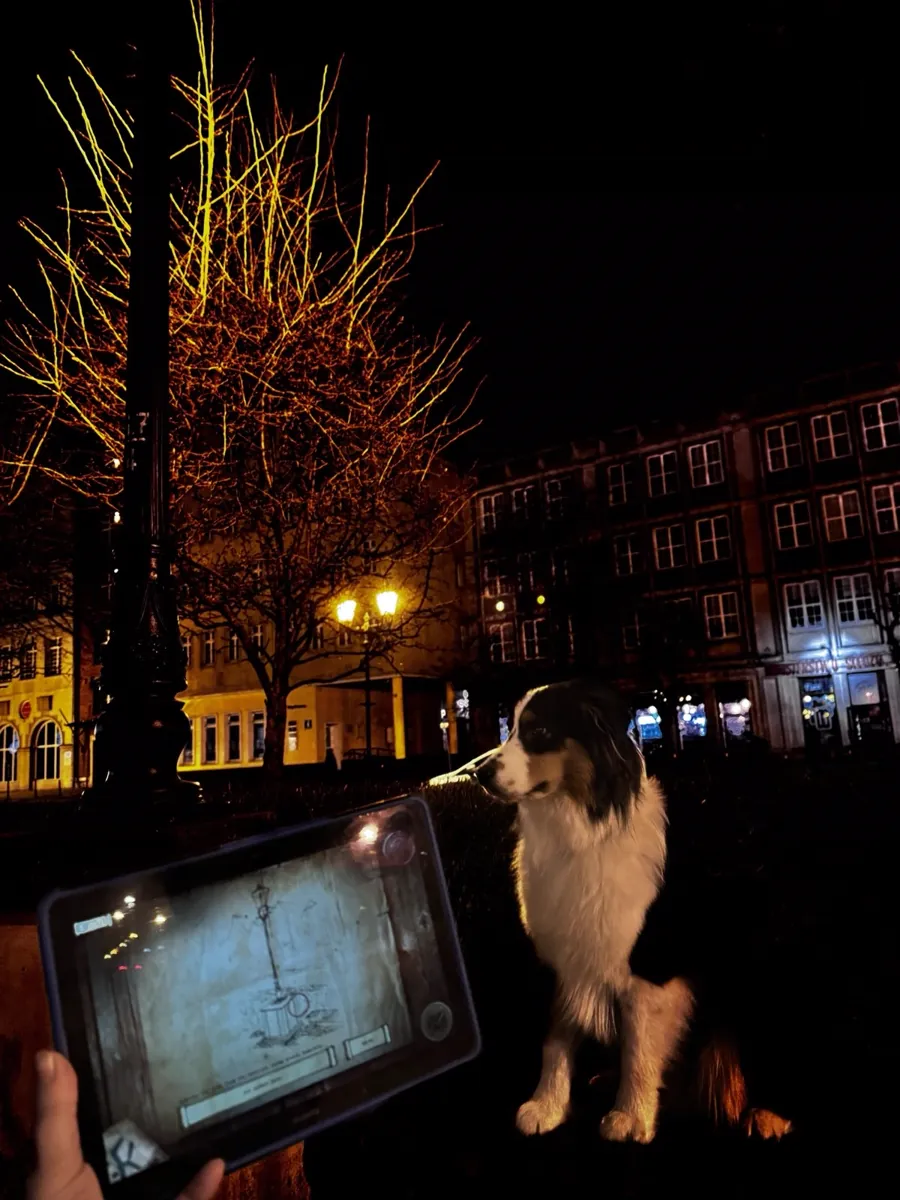 Night city game with tablet in Gdansk