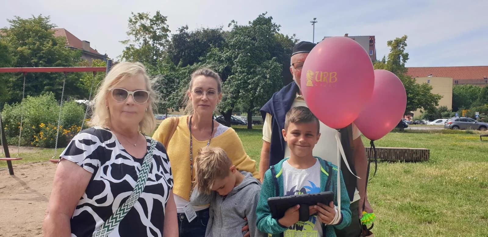 Group with URB balloons during event